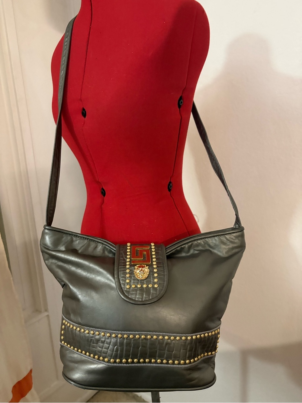 Vintage Stud-Accent Black Shoulder Bag with Gold Medallion